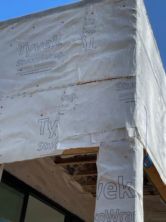 Housewrap damage from other trades working before wrapping complete